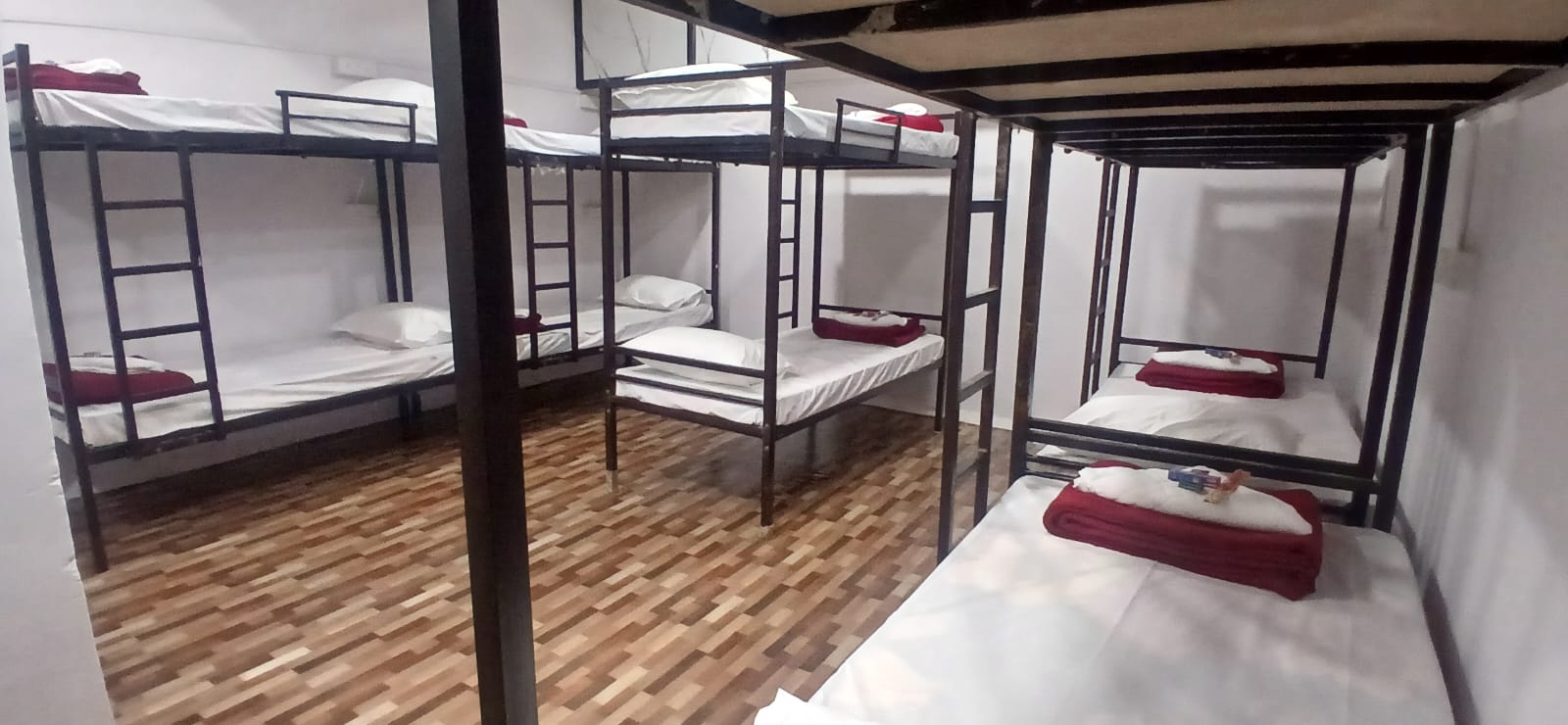 Affordable dormitory bunk beds at Hotel Sapphire Inn Surat — budget stay near Surat Railway Station